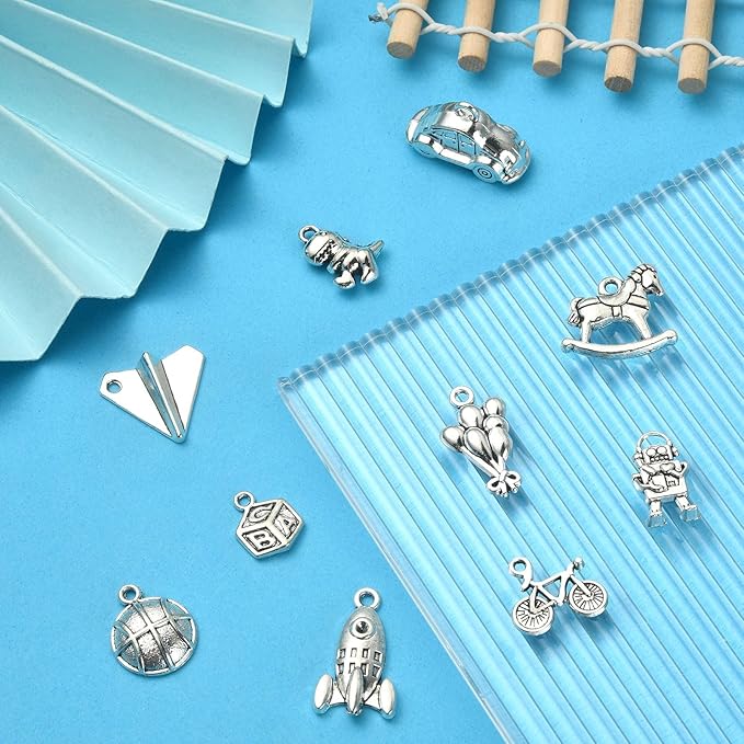 Stiesy 100 Pcs Toy Themed Tibetan Alloy Charms Car Balloon Dinosaur Robot Horse Basketball Charms for Men Women Bracelets Necklaces Jewelry Making