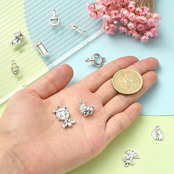 Stiesy 100 Pcs Baby Girl Themed Tibetan Alloy Charms Bell Shoes Baby Feet Feeding Bottle Baby Carriage Charms for Jewelry Making DIY Crafts