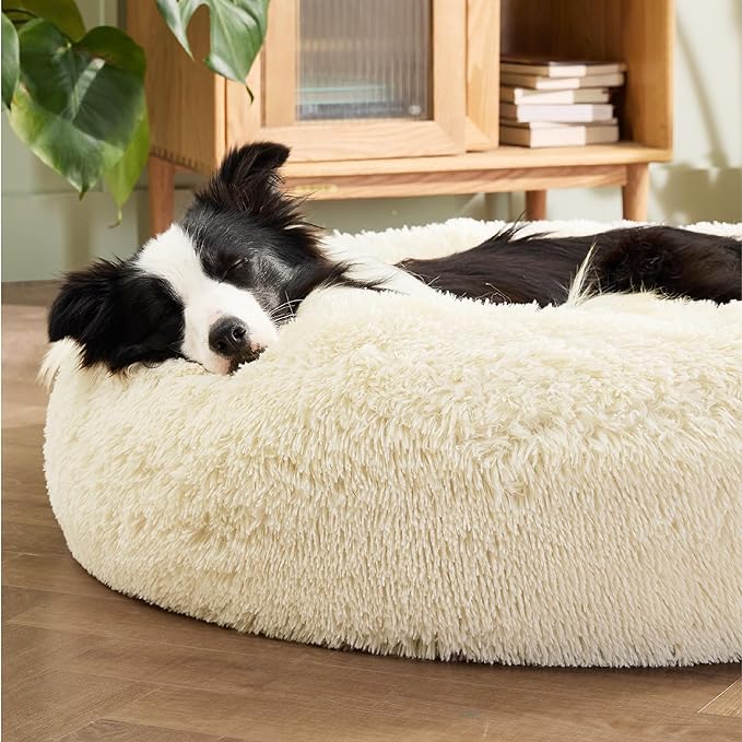 Bedsure Calming Dog Bed for Large Dogs - Donut Washable Large Pet Bed, Anti-Slip Round Fluffy Plush Faux Fur Dog Bed, Fits up to 100 lbs Pets, Oat Milk, 36 inches